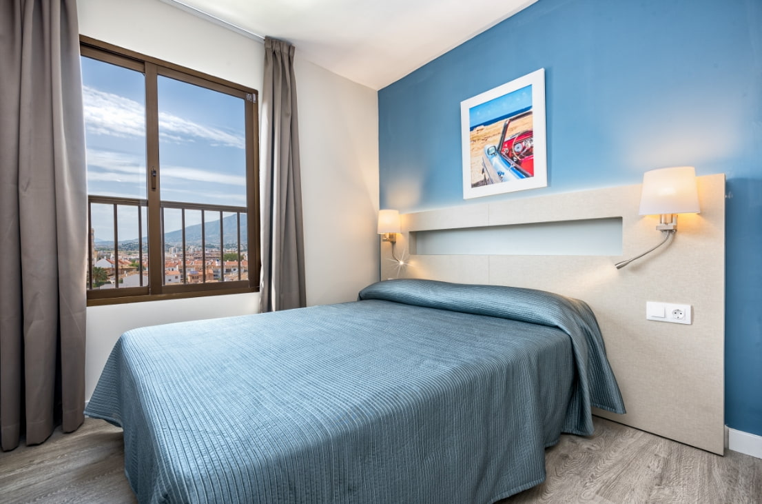 Bedroom with double bed and sea view