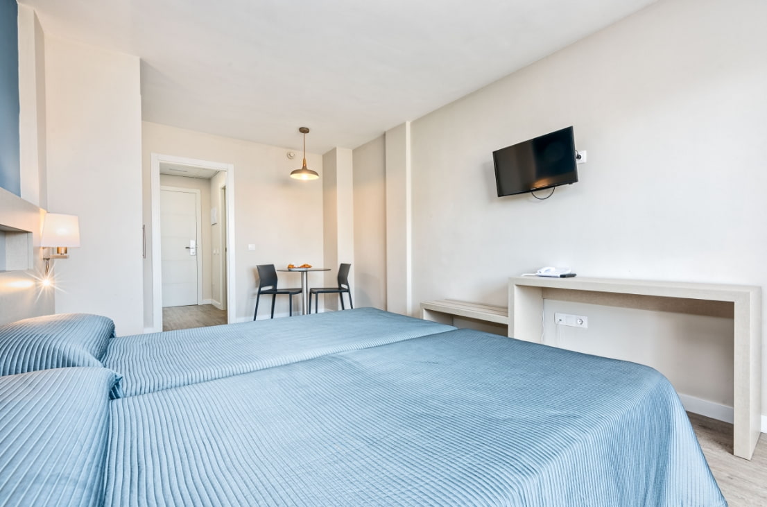 Bedroom with TV and dining area