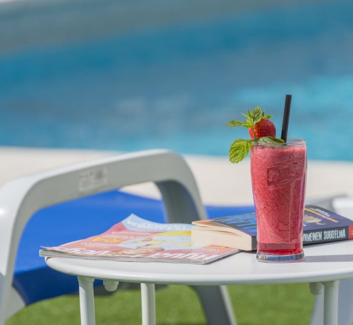 Cocktail by the pool at Veramar Aparthotel